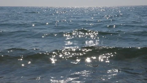 Beautiful slow motion cresting sunlit waves. Shore of Lake Ontario, Canada. Stock Footage