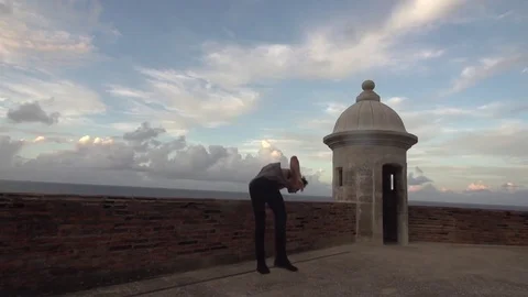 Beautiful Slow Motion Flip Off Brick Wall in San Juan With Ocean in Background Stock Footage 79276576