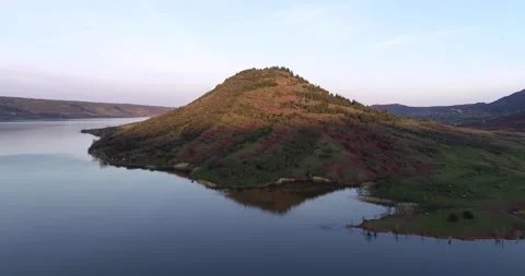 Beautiful slow motion mountains range landscape water reflection Lac Du Salagou Stock Footage 196820353