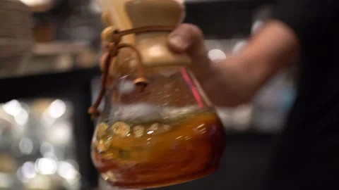 A Beautiful Slow-Motion Shot: Gently Shaking A Transparent Coffee Brewer. Stock Footage 180839064