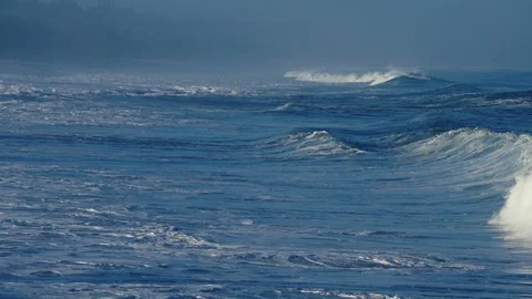 Beautiful slow motion slo mo ocean waves crashing and breaking off the sea shore Stock Footage 147337430