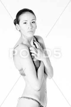 Beautiful small girl in lingerie posing Stock Photos