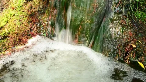 Beautiful small waterfall with clear bubbling water Stock Footage 74805581