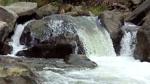 Beautiful small waterfall on the river stream on mountain Stock Footage 124040620