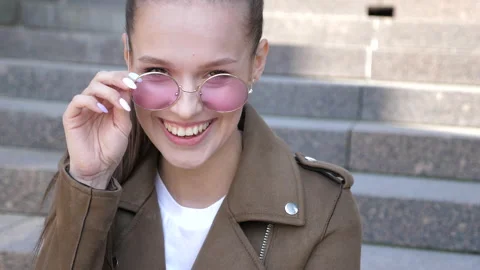 Beautiful smiling brunette model dressed in summer hipster jacket clothes Stock Footage 140994017