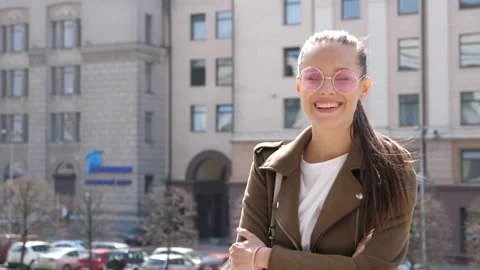 Beautiful smiling brunette model dressed in summer hipster jacket Stock Footage 140995807