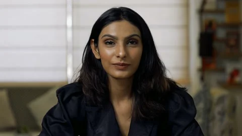 Beautiful smiling confident young Indian ethnic woman pretty face looking at  Vídeo Stock 155199378