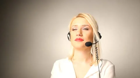 Beautiful smiling helpdesk call center operator at her laptop Stock Footage 10585264