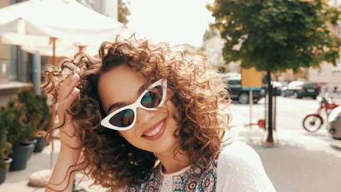 Beautiful smiling model with afro curls hairstyle Stock Footage 141523070