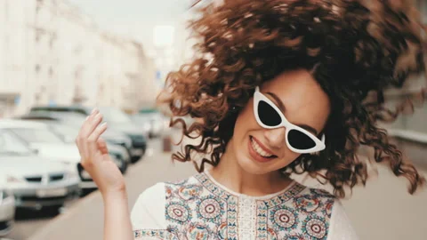 Beautiful smiling model with afro curls hairstyle Stock Footage 141528191