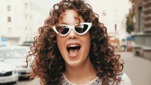 Beautiful smiling model with afro curls hairstyle Stock Footage 141528453