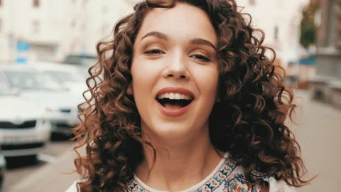 Beautiful smiling model with afro curls hairstyle Stock Footage 141528796