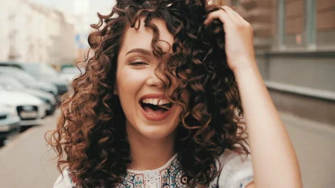 Beautiful smiling model with afro curls hairstyle Stock Footage 141528853