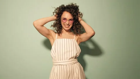 Beautiful smiling model with afro curls hairstyle Stock Footage 142215912