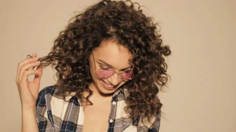Beautiful smiling model with afro curls hairstyle Stock Footage 142223521