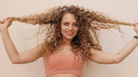 Beautiful smiling model with afro curls hairstyle Stock Footage 146053794