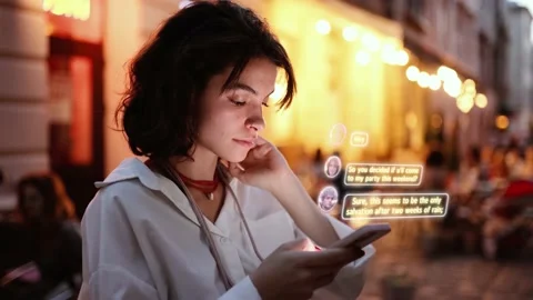 Beautiful Smiling Woman Using Phone on a City Street at Night. Visualization of Stock Footage 231635341