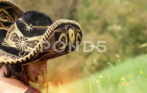 Beautiful smiling young girl with sombrero Stock Photos