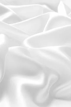 Beautiful smooth elegant wavy white satin silk luxury cloth fabric texture. Stock Photos