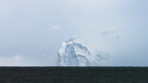 Beautiful snow covered mountains around the lake Stock Footage 116787341