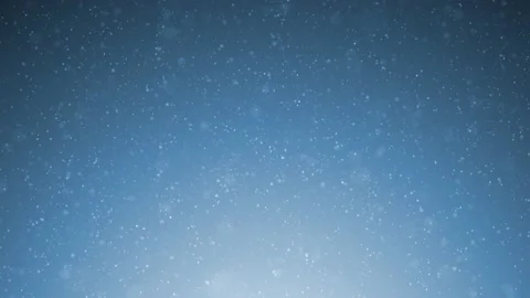 Beautiful snowflakes slowly falling down on a bright blue night sky Stock Footage 148579564