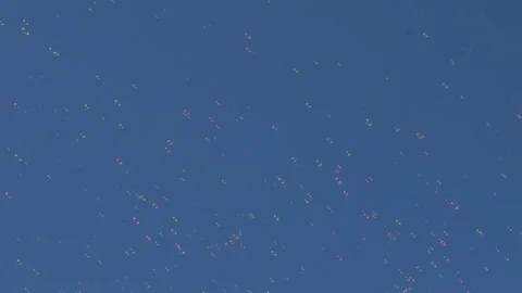 Beautiful soap bubbles in a cloudy blue sky Stock Footage 88235515