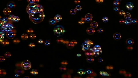 The beautiful soap bubbles flying on a black background. slow motion Stock-Footage 163304597