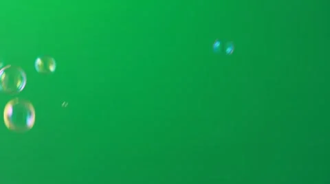 Beautiful soap bubbles on green Stockbeeldmateriaal 55410131