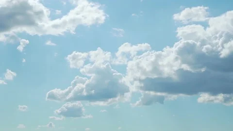Beautiful Soaring White Clouds in Sunlight in Light Blue Sunny Sky Timelapse. Am Stock Footage 231400447