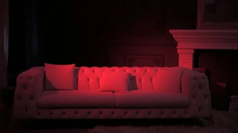 Beautiful Sofa in Red Light Room Cinematic View Stock Footage 263825275