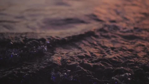 Beautiful soft focus surface of sea ocean wave with rays of sun at sunset dawn Stockbeeldmateriaal 129482496
