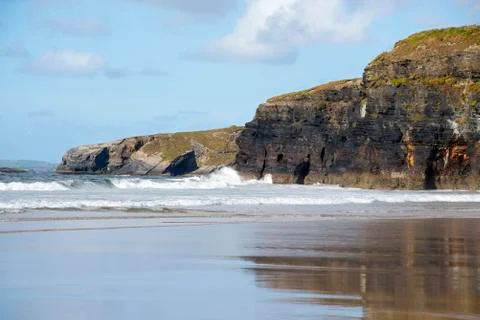 Beautiful soft waves break on the beach Stock Photos