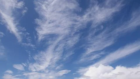 Beautiful soft wispy cloud formation against a deep blue sky Stock Photos