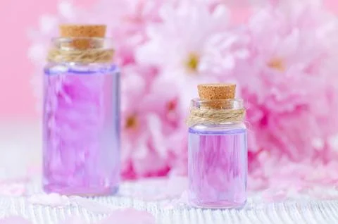 Beautiful spa composition, aromatherapy with essential oils, fresh flowers on Stock Photos