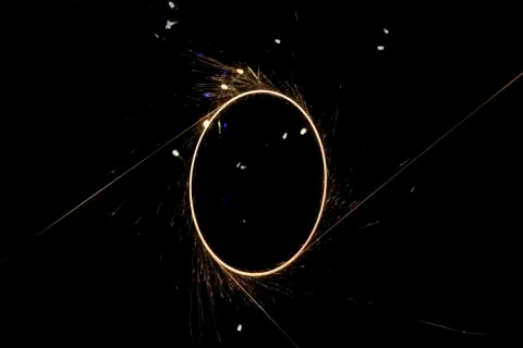 Beautiful sparkler in a circle on a black background Stock Photos