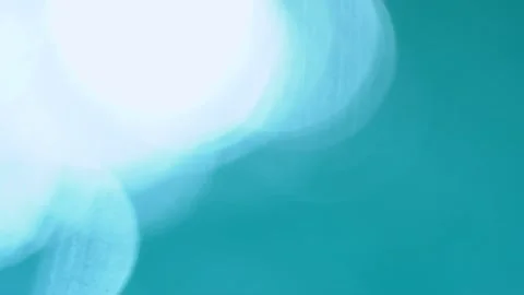 Beautiful sparkling shiny texture of blurry blue water with sun reflected on Video stock 133683000