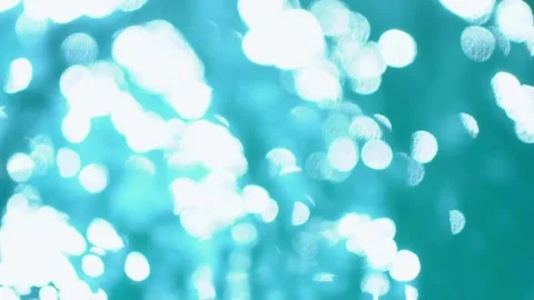 Beautiful sparkling shiny texture of blurry blue water with sun reflected on Video stock 134503369