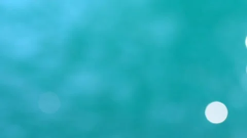 Beautiful sparkling shiny texture of blurry blue water with sun reflected on Video stock 134536452