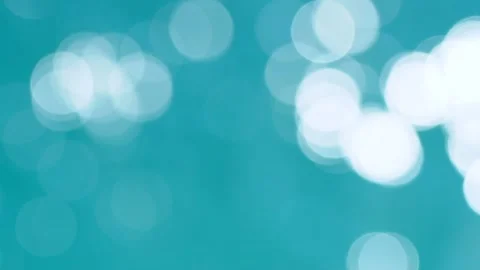 Beautiful sparkling shiny texture of blurry blue water with sun reflected on Stock Footage 134750586