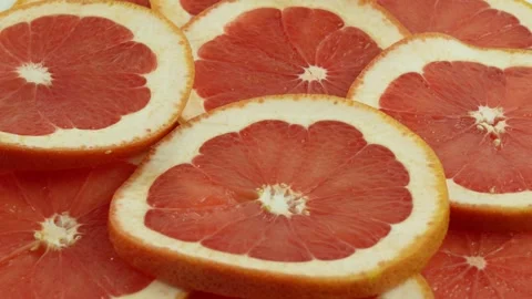 Beautiful spinning fruit grapefruit. Grapefruit fresh, sliced, juicy, red Stock Footage 263988992