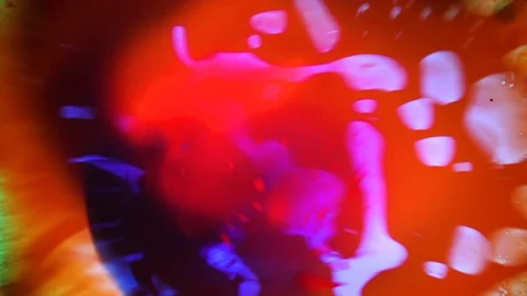 Beautiful spinning liquid dye pattern Stock Footage 127723087