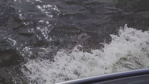 Beautiful splashes and marks on the water from a motorboat Stock Footage 329248755