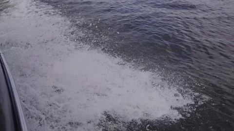 Beautiful splashes and marks on the water from a motorboat Stock Footage 329248807