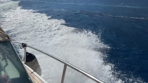 Beautiful splashes and water wake from sailing motorboat, amazing turquoise Stock Footage 318648314