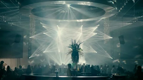 Beautiful spotlights while dancing at a wedding in a dark banquet hall. Stock Footage 225641657