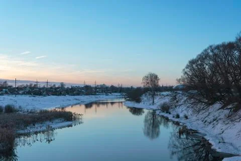 Beautiful spring landscape with a small quiet river in the evening. Stock Photos