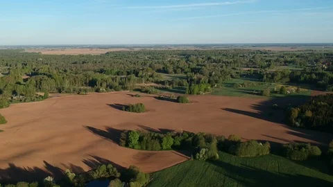 Beautiful spring landscape with sowed fields and groves, aerial view Stock Footage 89864852