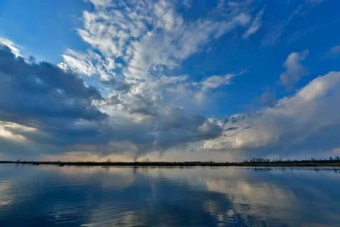 Beautiful spring sunset on the river. Stock Photos