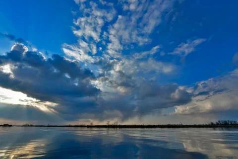 Beautiful spring sunset on the river. Stock Photos