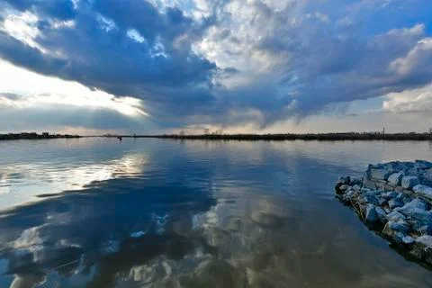 Beautiful spring sunset on the river. Stock Photos